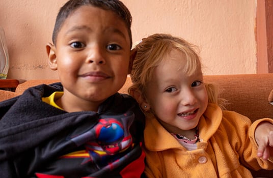 Two Ecuadorian children smiling