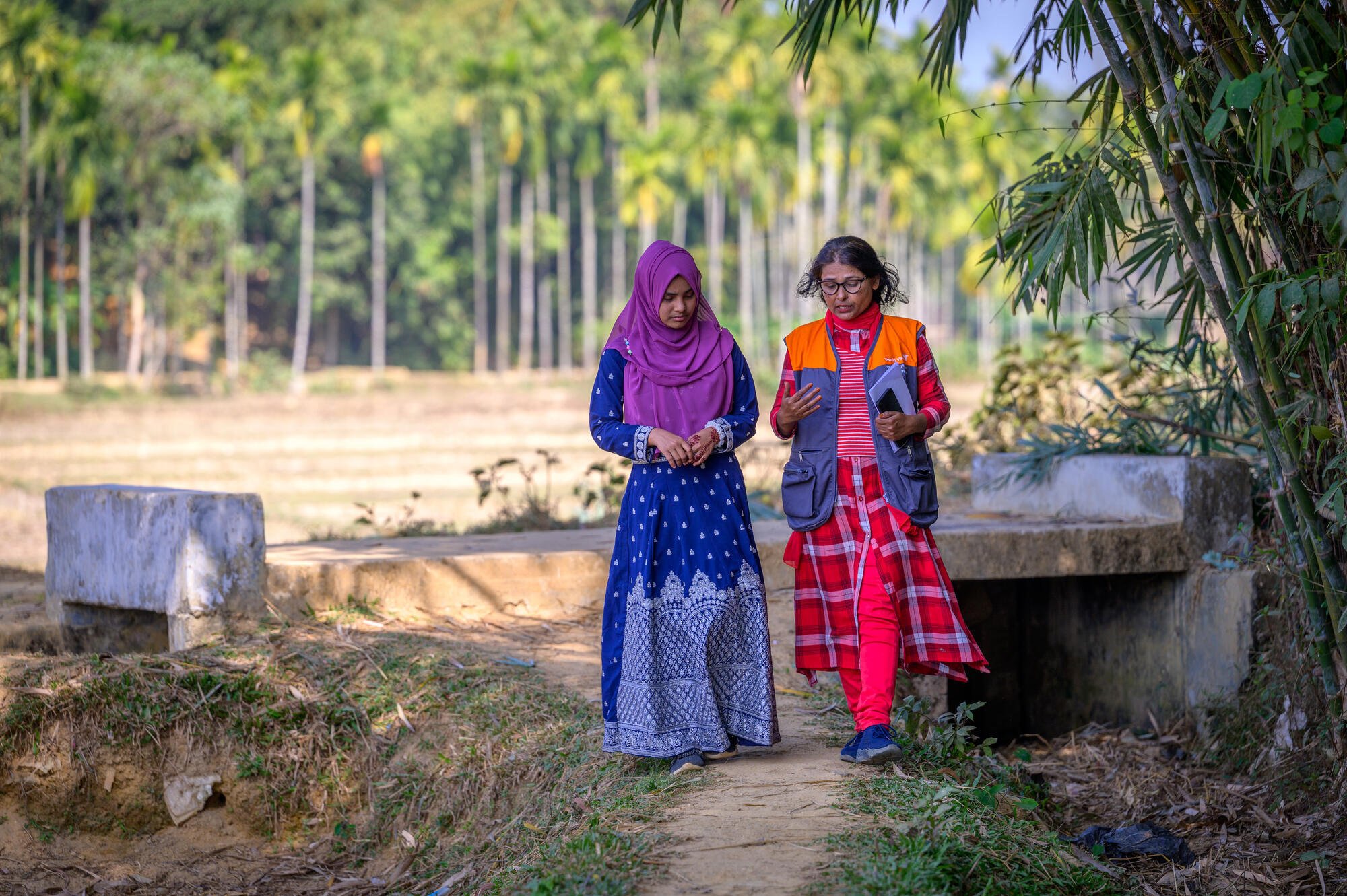 two women walking two women walking