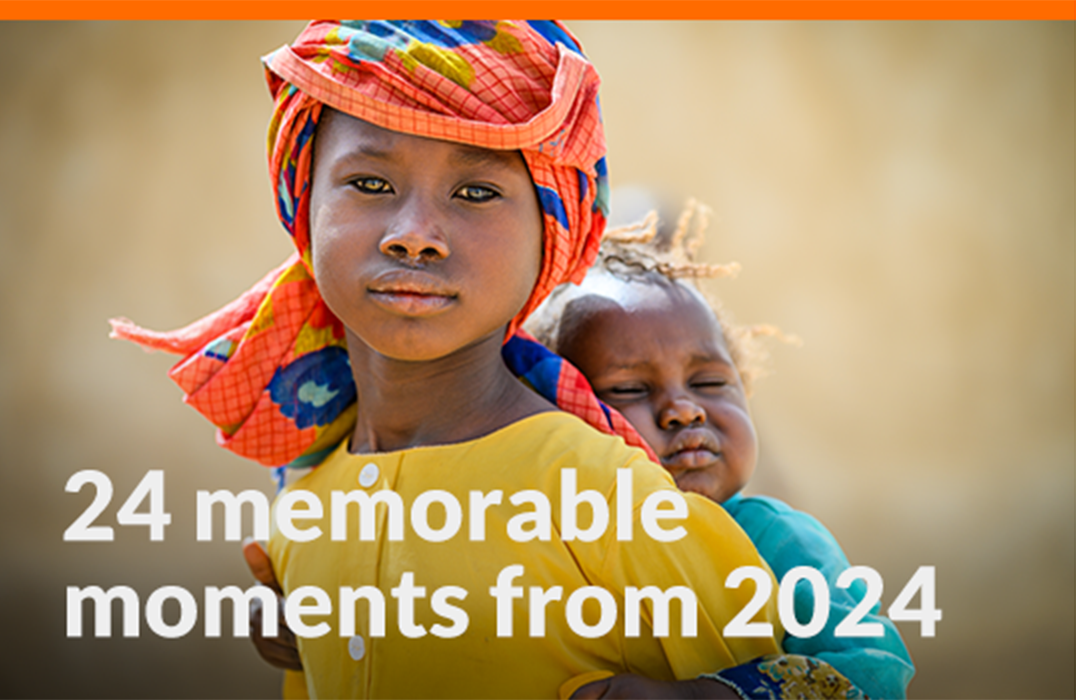A girl wearing an orange headdress and yellow shirt carries a baby on her back. Text on image reads: 24 memorable moments from 2024.