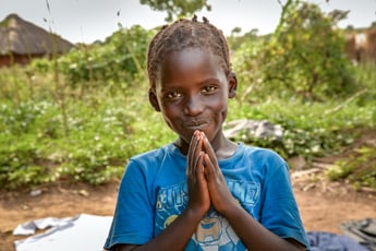 Praying child in Africa