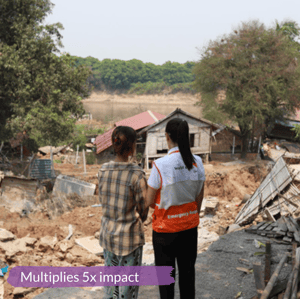 two women looking out at a disaster