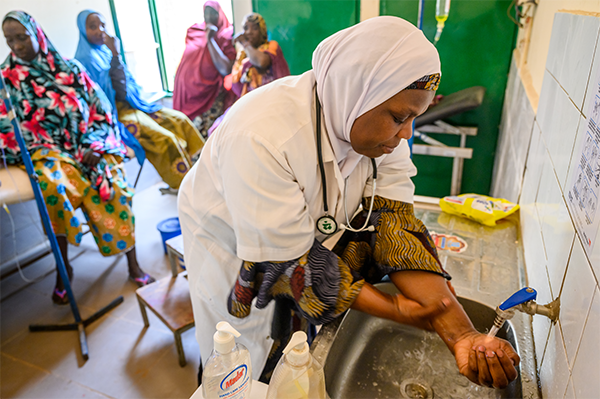 A doctor in Niger washes her hands in a sanitary sink before seeing patients.