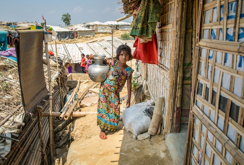 Eight-year-old Ismatara, a refugee in Bangladesh, used to collect dirty water before World Vision helped her family gain access to clean water. “I can drink water and bathe easily now,” she says. (©2019 World Vision, photo by Jon Warren)