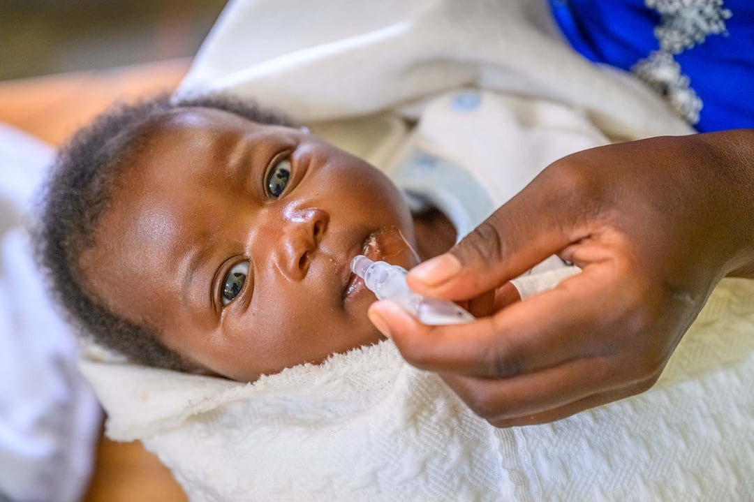 A young child in Africa receives medication.