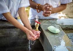 Children wash their hands with soap at a sink in Honduras. (©2018 World Vision/ photo by Jon Warren)