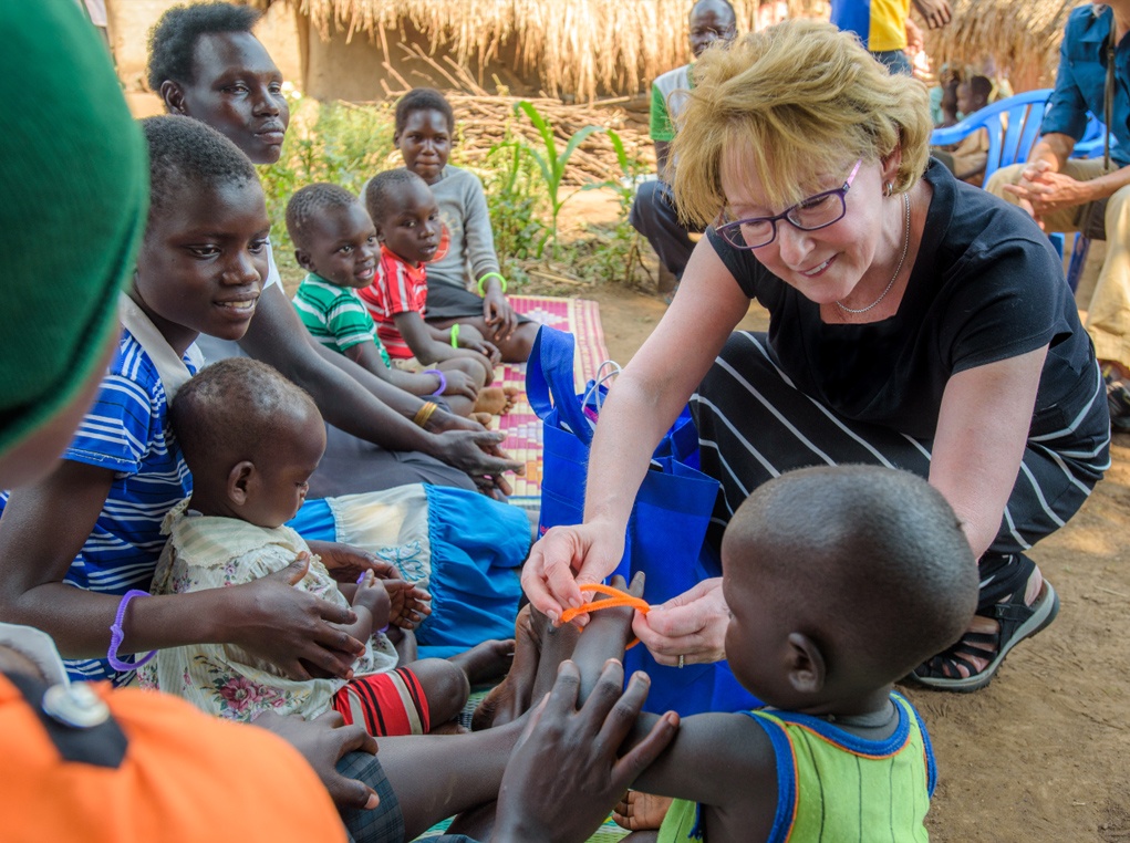Laura Abernathy with children in Uganda on a Vision Trip