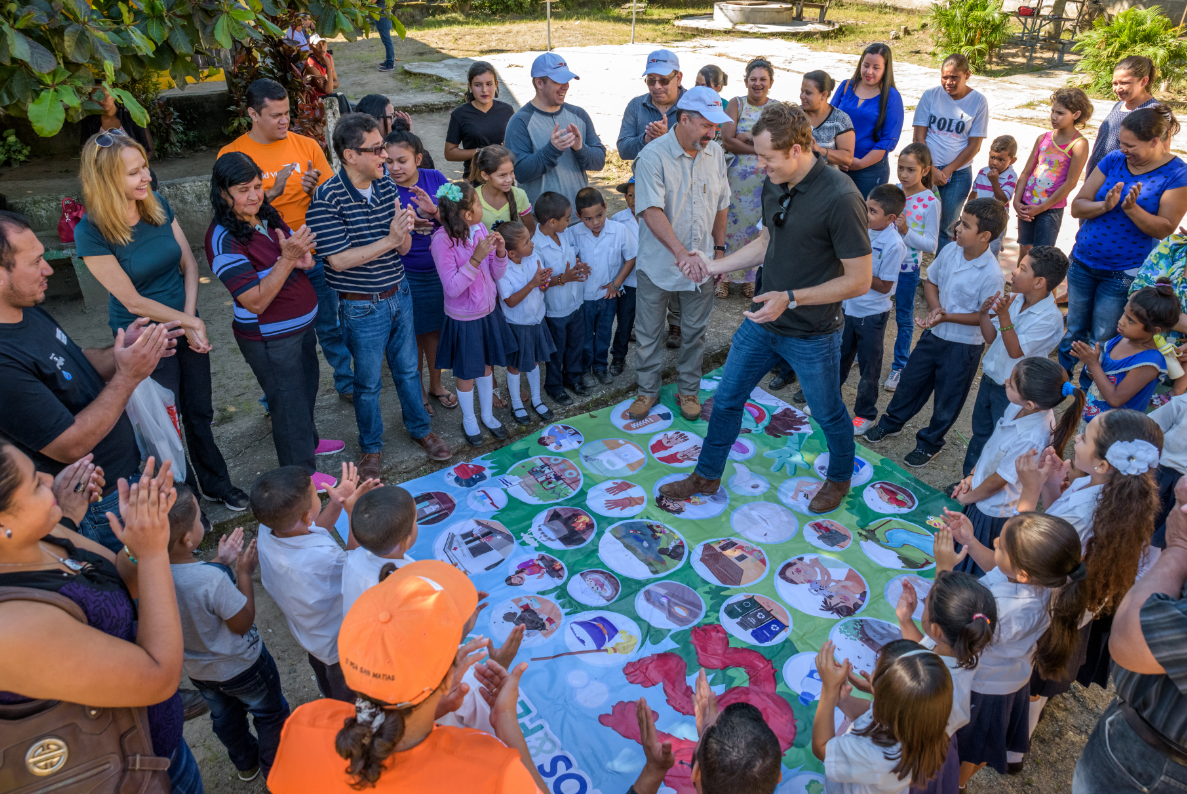 Cody playing a Sesame Street WASH game at a school that received clean water. The game helps children learn good hygiene habits.