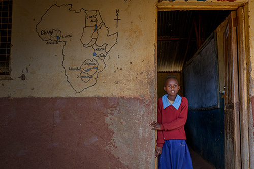 girl standing by door entry way