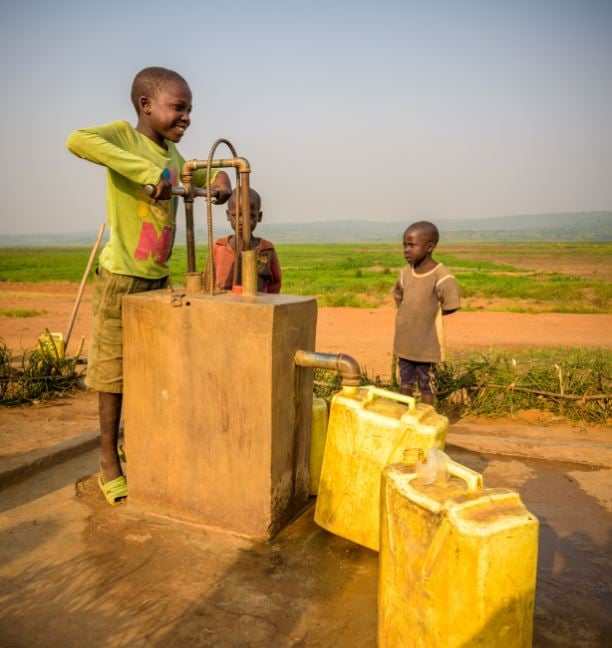 Children pumping water